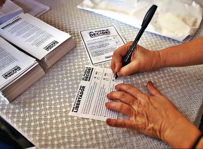 Woman killed, 3 wounded as tensions rise with Venezuela vote