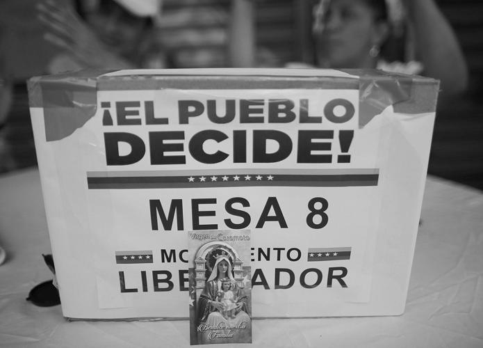 Woman killed, 3 wounded as tensions rise with Venezuela vote